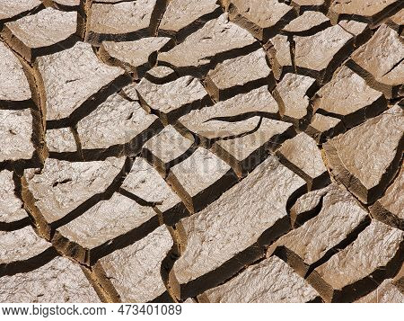 Dry And Cracked Soil Or Sediment Of The Treatment Pond