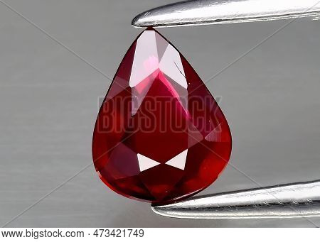 Natural Gem Red Ruby On Gray Background