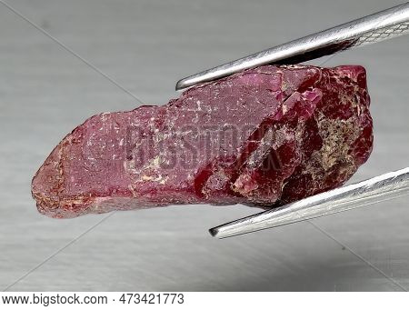 Natural Gem Red Ruby On Gray Background
