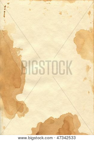 Carta colorata in modo uniforme con macchie di tè.