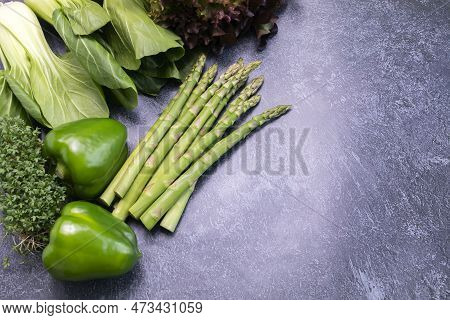 Flatly Assortment Of Fresh Organic Home Grown Green Vegetables On Gray Granite Table. Asparagus Plan