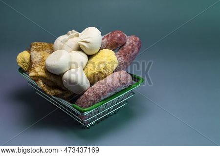 Basket With Semi-finished Products On A Dark Gray Background. Food For Quick Cooking.