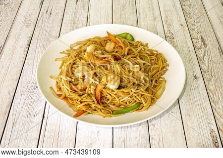 Chinese Wok Stir-fry Noodles With Cooked Shrimp, Vegetables And Bean Sprouts In A Chinese Restaurant