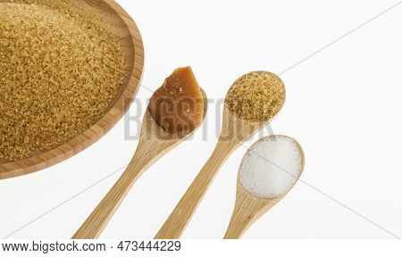 White Sugar, Brown Sugar And Sugar Cane Panela On White Background