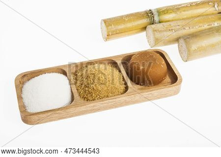 White Sugar, Brown Sugar And Sugar Cane Panela On White Background