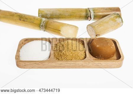 White Sugar, Brown Sugar And Sugar Cane Panela On White Background