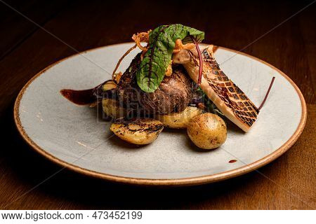 Great View Of Slice Of Grilled King Oyster Mushroom And Piece Of Fried Meat With Potatoes On Plate