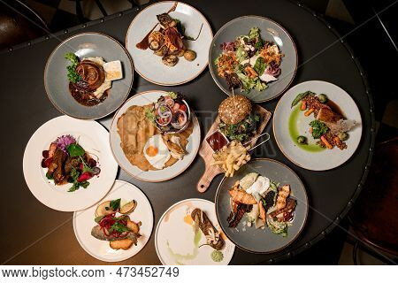 Great Top View Of Plates With Different Dishes On Table