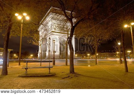 The Triumphal Arch In Rainy Evening, Paris, France.