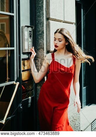 Stunning Face. Intercom, Interphone. Young Cheerful Fashionable Woman During Walking On Street. Fema