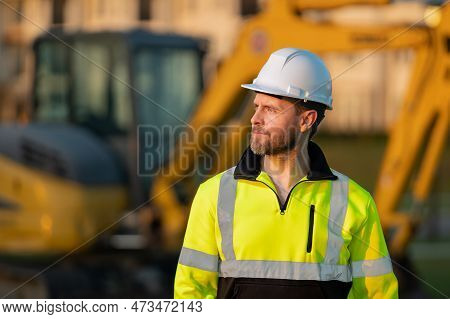 Worker In Helmet On Site Construction. Man Excavator Bulldozer Worker. Construction Driver Worker Wi