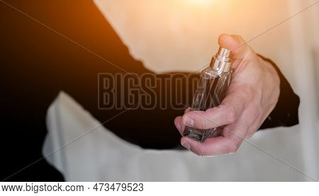 Man In Formal Wear, Bottle Of Perfume, Closeup. Fragrance Smell. Men Perfumes. Fashion Cologne Bottl