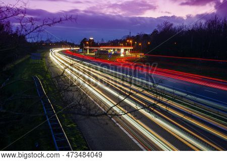 Oldenzaal, Netherlands - March 24, 2023: Long Exposure Shot Of Traffic On The E30 Highway From Amste