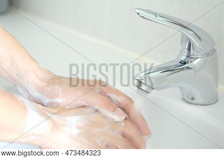 Hand Of Beauty Woman  Wash Your Hands At The Wash Basin With Foam, Cleanse The Skin And Have Water F