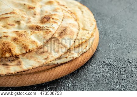 Pita Arab Bread. Flatbreads. Food Recipe Background. Close Up.
