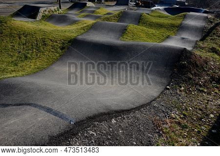 Bike Path In The Car Park Pumping (moving Up And Down) Is Used Instead Of Pedaling And Bouncing To M