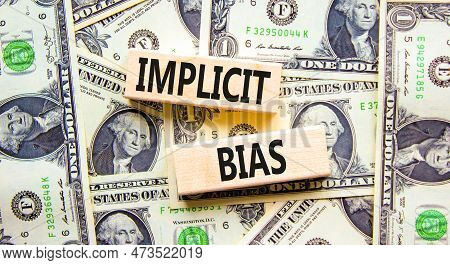 Implicit Bias Symbol. Concept Words Implicit Bias On Wooden Block. Beautiful Background From Dollar 