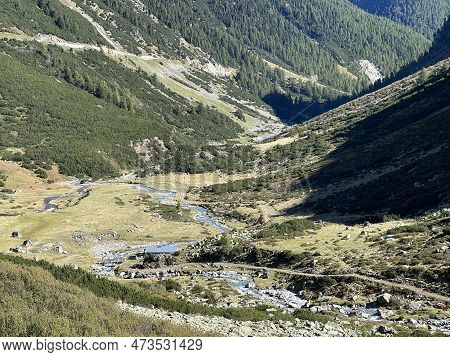Beautiful Autumn Panorama Of The Alpine Valley Val Grialetsch And The Stream Aua Da Grialetsch In Th