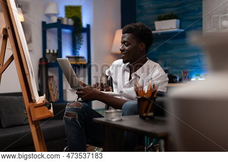 African American Male Artist Living With Chronic Desease Taking Art Classes Remotely Via Video Call 