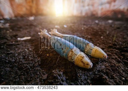 Unexploded Mortar Mines On Ground. War Actions Aftermath