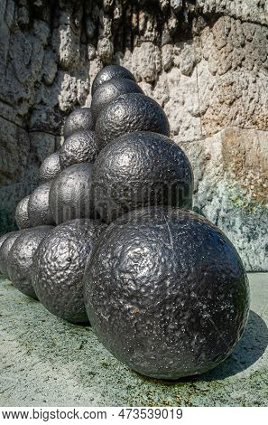 Copenhagen, Denmark - September 13, 2010: Pile Of Black Cannon Balls Closeup At Admiral Ivar Huitfel