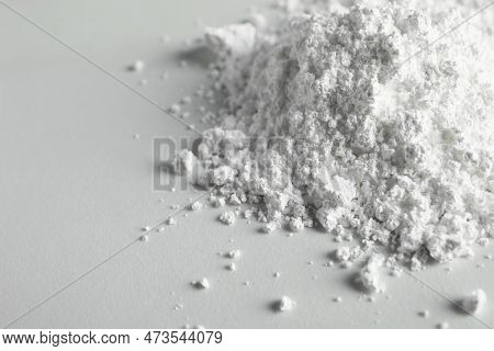Heap Of Calcium Carbonate Powder On White Table, Closeup