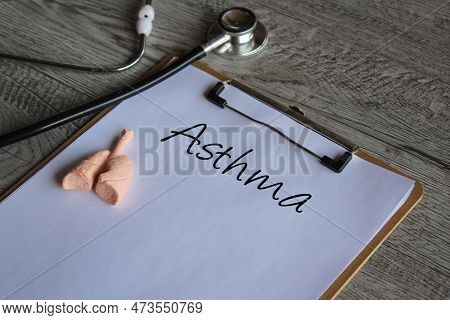 Stethoscope, Human Lung Model And Paper Clipboard With Text Asthma. Medical And Healthcare Concept