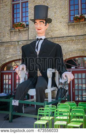 Bergues, France - July 5, 2022: A Marionette Of Bergues In France In Front Of A Building, Summer Day