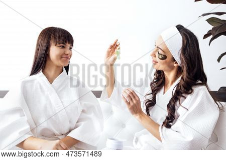Mother And Teen Daughter Have Beauty Day Togather, Copy Space. Mother And Daughter Use Collagen Gold