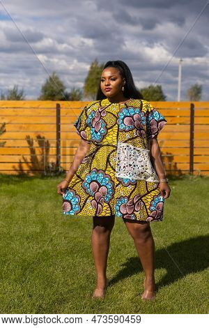 Portrait Of Beautiful African American Woman Having Fun On Village Or Suburbian. Outdoor Portrait Of