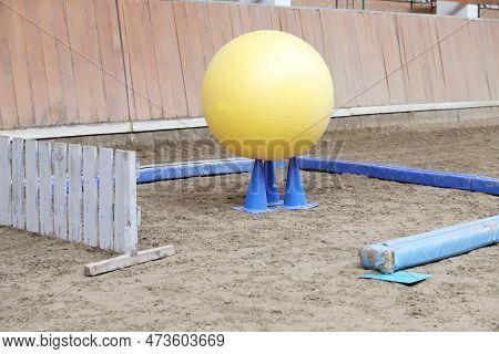 Plastic Physioball On The Sand During Training For Beginner Riders And Horses At Riding School Indoo
