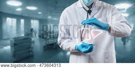 Doctor Protecting And Listening To The Liver On A Blurred Background.