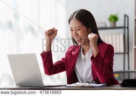 Asian Business Person Happy While Reading Email Have A Good News In Laptop Computer. Business Financ
