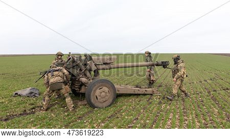 Donetsk Reg, Ukraine - Mar. 21, 2023: A Ukrainian Soldier Is Seen Preparing To Fire The 122 Mm D-30 
