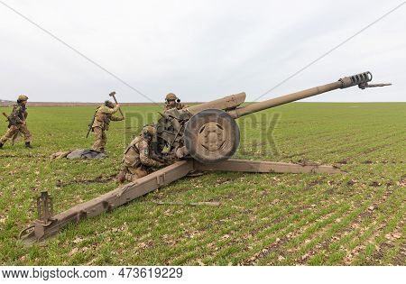 Donetsk Reg, Ukraine - Mar. 21, 2023: A Ukrainian Soldier Is Seen Preparing To Fire The 122 Mm D-30 