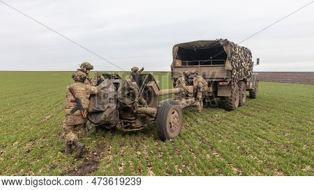 Donetsk Reg, Ukraine - Mar. 21, 2023: A Ukrainian Soldier Is Seen Preparing To Fire The 122 Mm D-30 