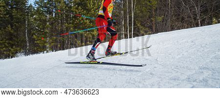 Zlatoust, Russia - March 17 2019: Male Athlete Running Uphill In Cross-country Skiing, Fischer Racin