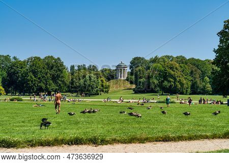 Munich, Germany - Jul 28, 2022: The English Garden In Munich, Bavaria, Germany Overflowing With Youn