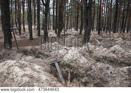 Crosses Are Seen At A Forest Grave Site After An Exhumation In The Town Of Izium, Recently Liberated