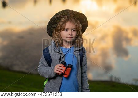 Scout Boy Wearing Explorer Hat And Backpack Outdoor. Explorer And Adventure With Binocular.