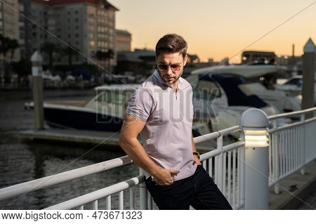 Stylish Man Wearing Sunglasses And Shirt. Handsome Man Outdoors Portrait. Portrait Of Stylish Male M