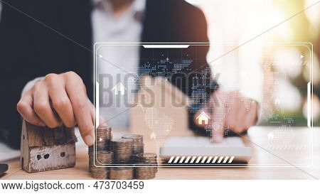 Man Holding Coin And Use Calculator To Calculate Interest Rate,real Estate Business,appraisal Of Pro