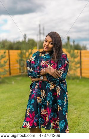 Portrait Of Beautiful African American Woman Having Fun On Village Or Suburbian. Outdoor Portrait Of