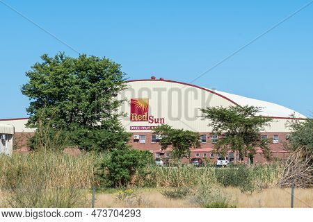 Kanoneiland, South Africa - Feb 25, 2023: A Road Scene, With A Dried Fruit And Nuts Depot, On Road N