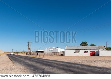 Kanoneiland, South Africa - Feb 25, 2023: A Road Scene, With Businesses, Near Kononeiland. Power Inf