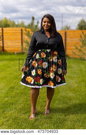 Portrait Of Beautiful African American Woman Having Fun On Village Or Suburbian. Outdoor Portrait Of