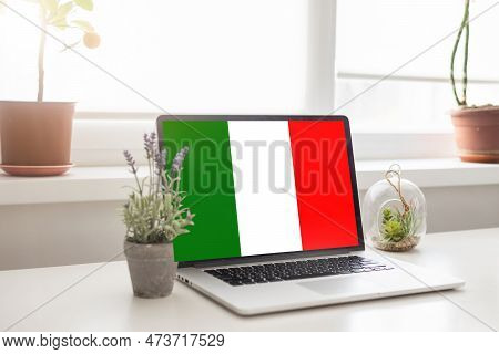 Laptop With Learn Italian On A Screen. Education Learning Italian Language School Concept