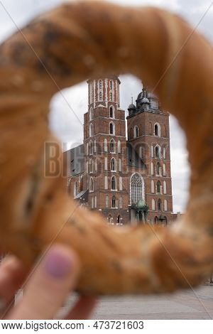 Tourist Woman Eating Bagel Obwarzanek Traditional Polish Cuisine Snack Waling On Market Square St. M
