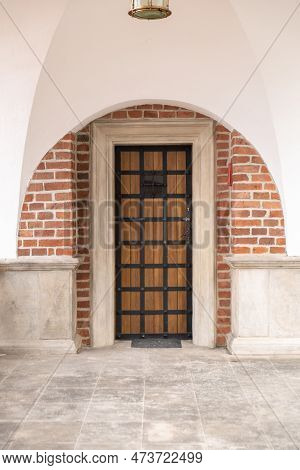 Old Wooden Brown House Door. Gorgeous Wooden Door In The Streets Krakow Poland. Antique Wooden Door 