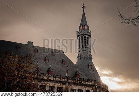 Picture Of The Aachener Rathaus At Dusk With A Focus On Its Tower. Aachen Town Hall Is A Landmark Of